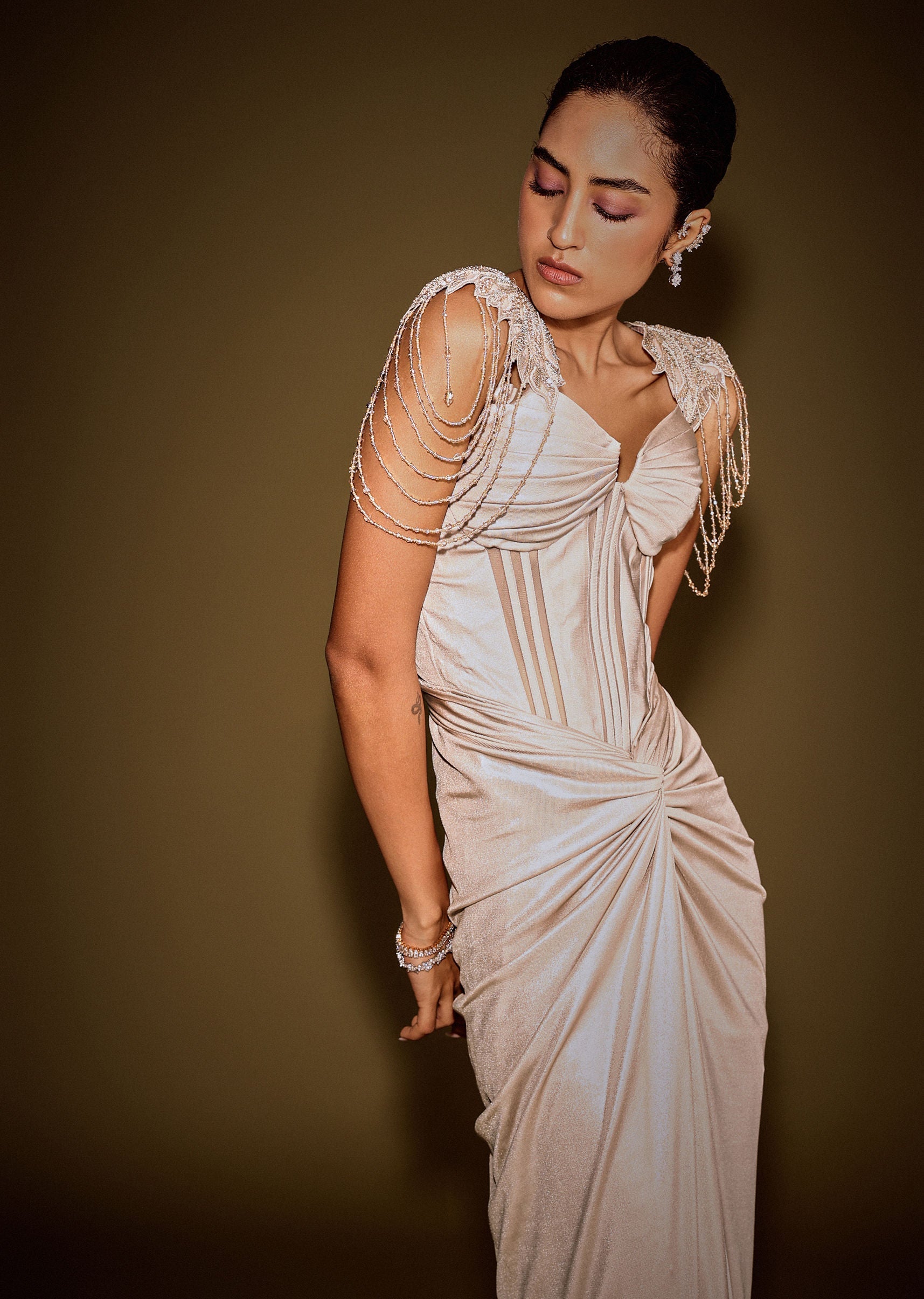 Champagne Drape Gown With Embroidered Shoulder Cape And Tassel Detailing