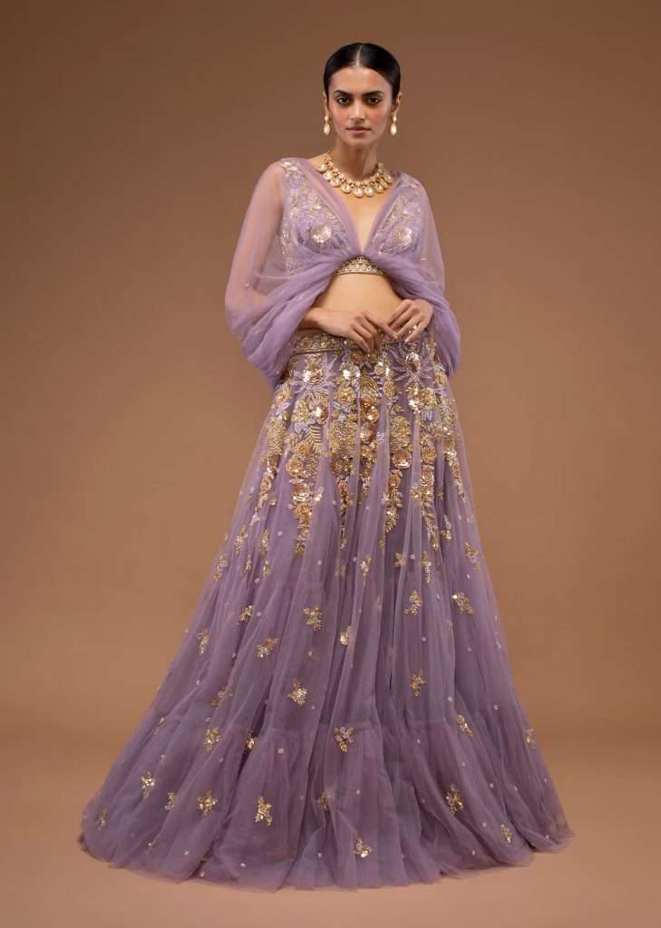 A woman photographed Shivani Singh in a Kalki lavender skirt and blouse with three-way fancy drapes and hand embroidery