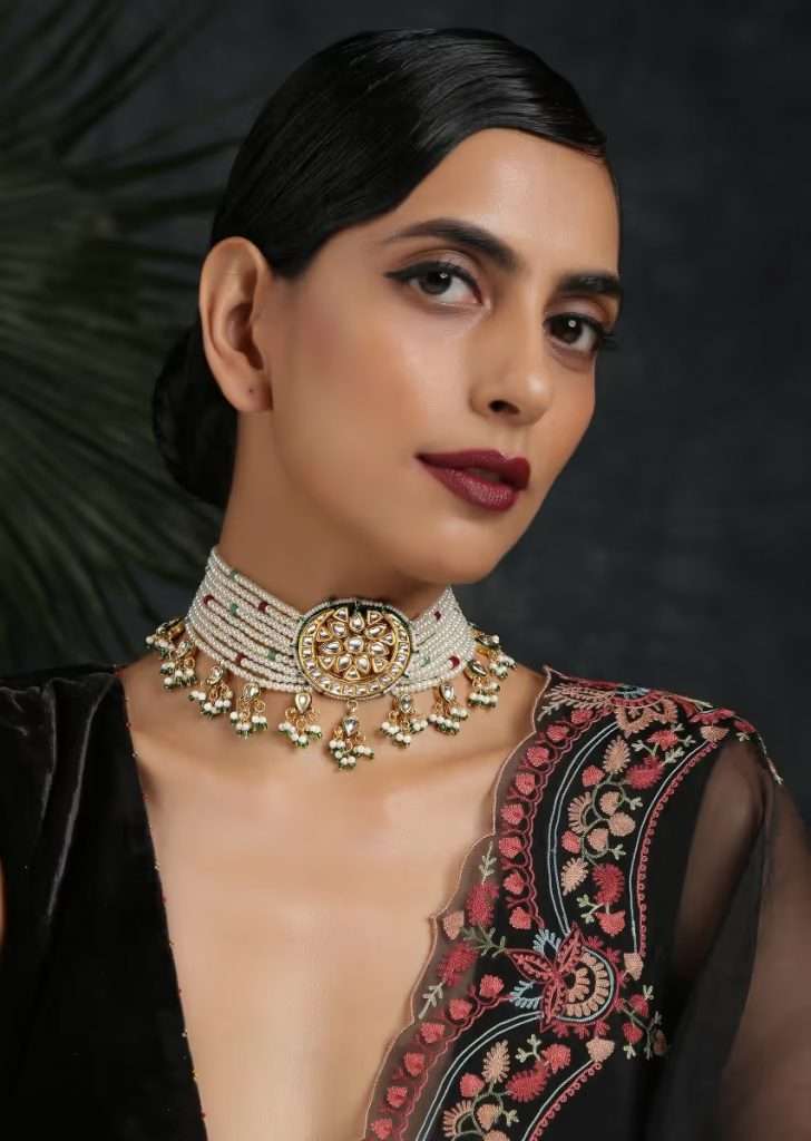 A Women Wearing Gold Plated Choker With Kundan Flower Highlight In The Centre, Moti Strings And Tassel Detailing By Paisley Pop