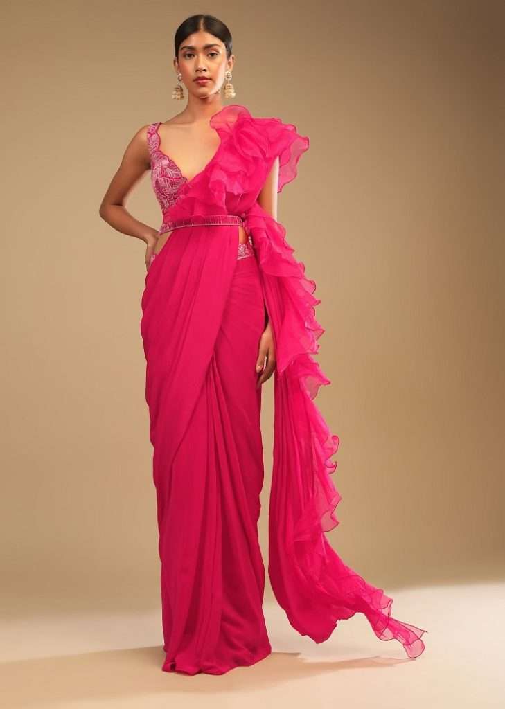 Women poses in Hot Pink Ready Pleated Saree In Crepe With Ruffle Frill On The Pallu And Beads Embroidered Crop Top And Belt