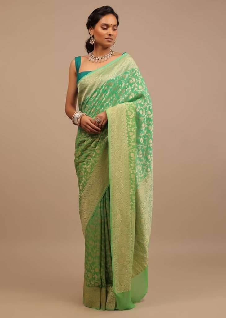 Women posing for photo wearing Mint Green Saree With Jaal Work On The Border And Pallu