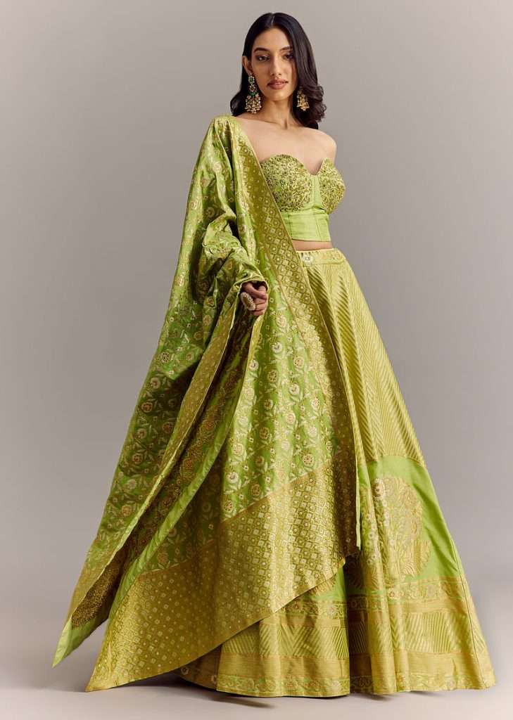 Green Brocade Lehenga With Embroidered Bustier And Banarasi Dupatta