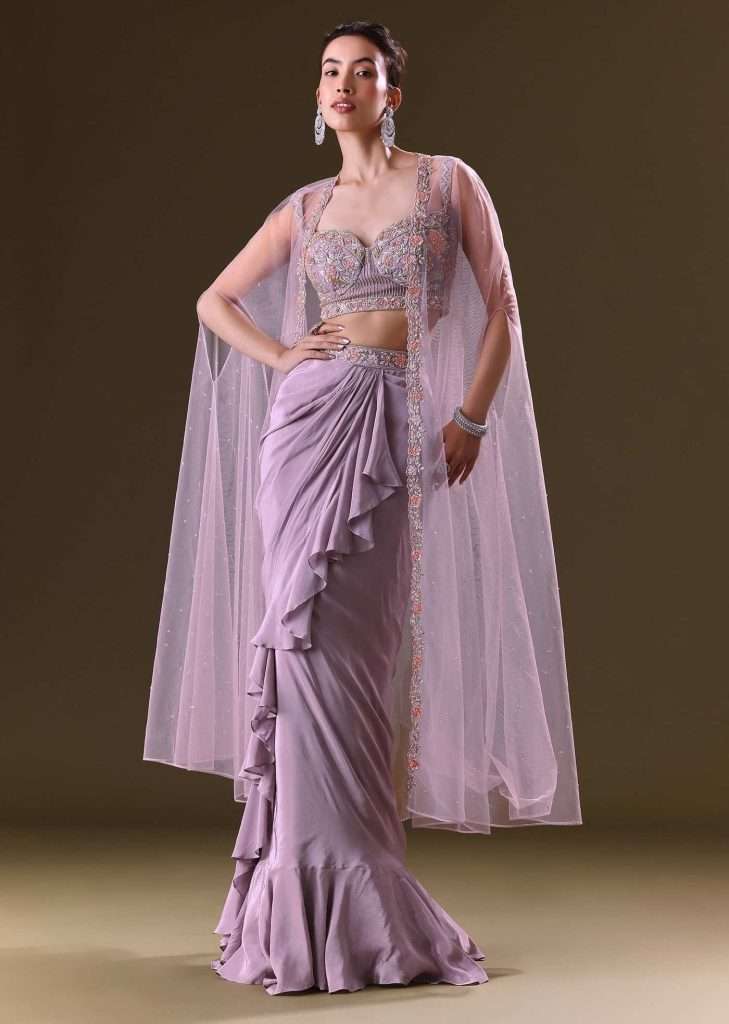 Mauve Ruffled Drape Skirt With Embroidered Blouse And Net Cape

