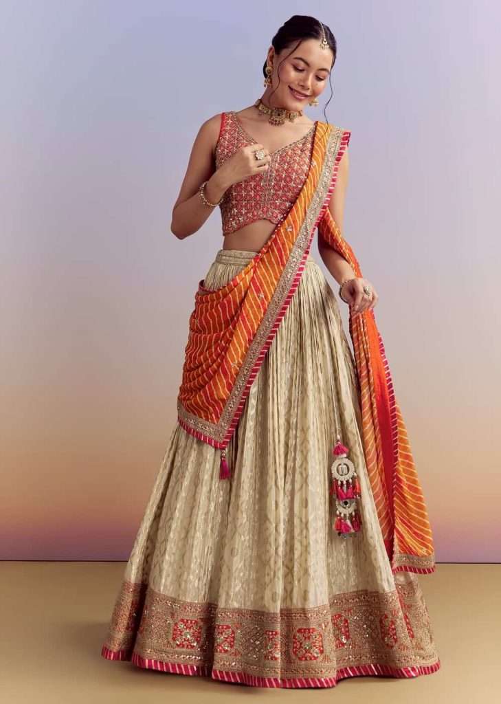 Orange Brocade Silk Bridesmaid Lehenga With Leheriya Dupatta

