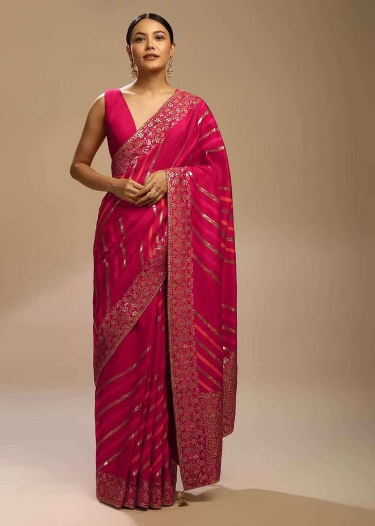 Rani Pink Saree In Dola Silk With Multi Colored Woven Diagonal Stripes And Floral Border

