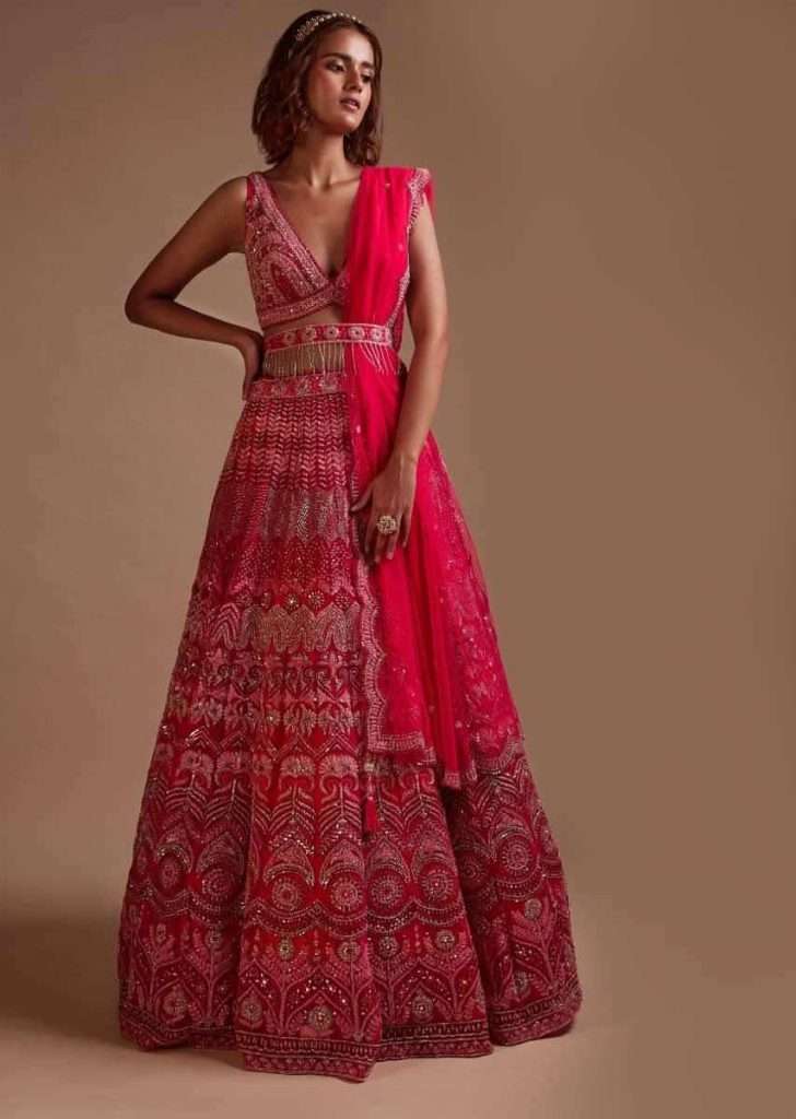 Regional Wedding Styles in India: A Fashion Guide for Every State 1 Hot Pink Lehenga Choli In Net With Mirror Work In Floral And Mughal Motifs Along With A Tassel Belt