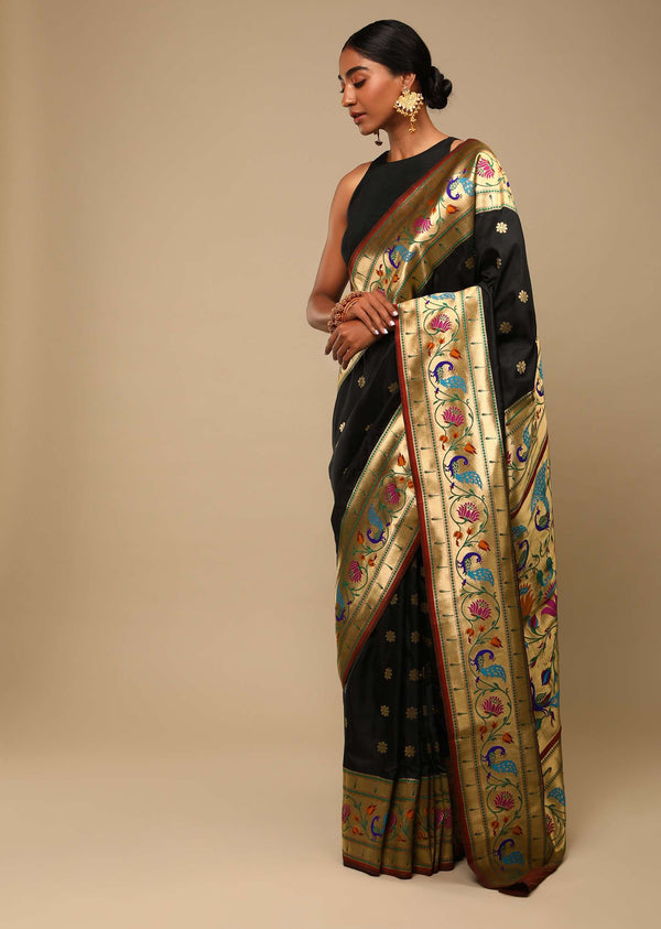 Black Saree In Art Handloom Silk With Woven Multi Colored Peacock Motifs On The Border, Floral Buttis And Unstitched Blouse
