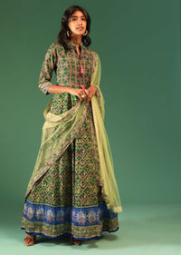 Bottle Green Anarkali Suit In Raw Silk With Patola Print And Kundan Detailing Along With A Yellow Net Dupatta