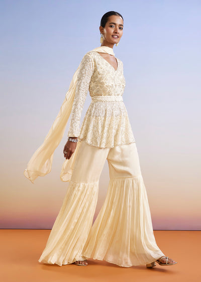 Cream Embroidered Peplum Sharara Suit With Dupatta And Belt