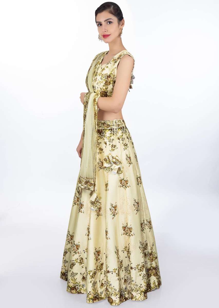 Cream satin crepe lehenga and blouse in digital floral print with matching net dupatta