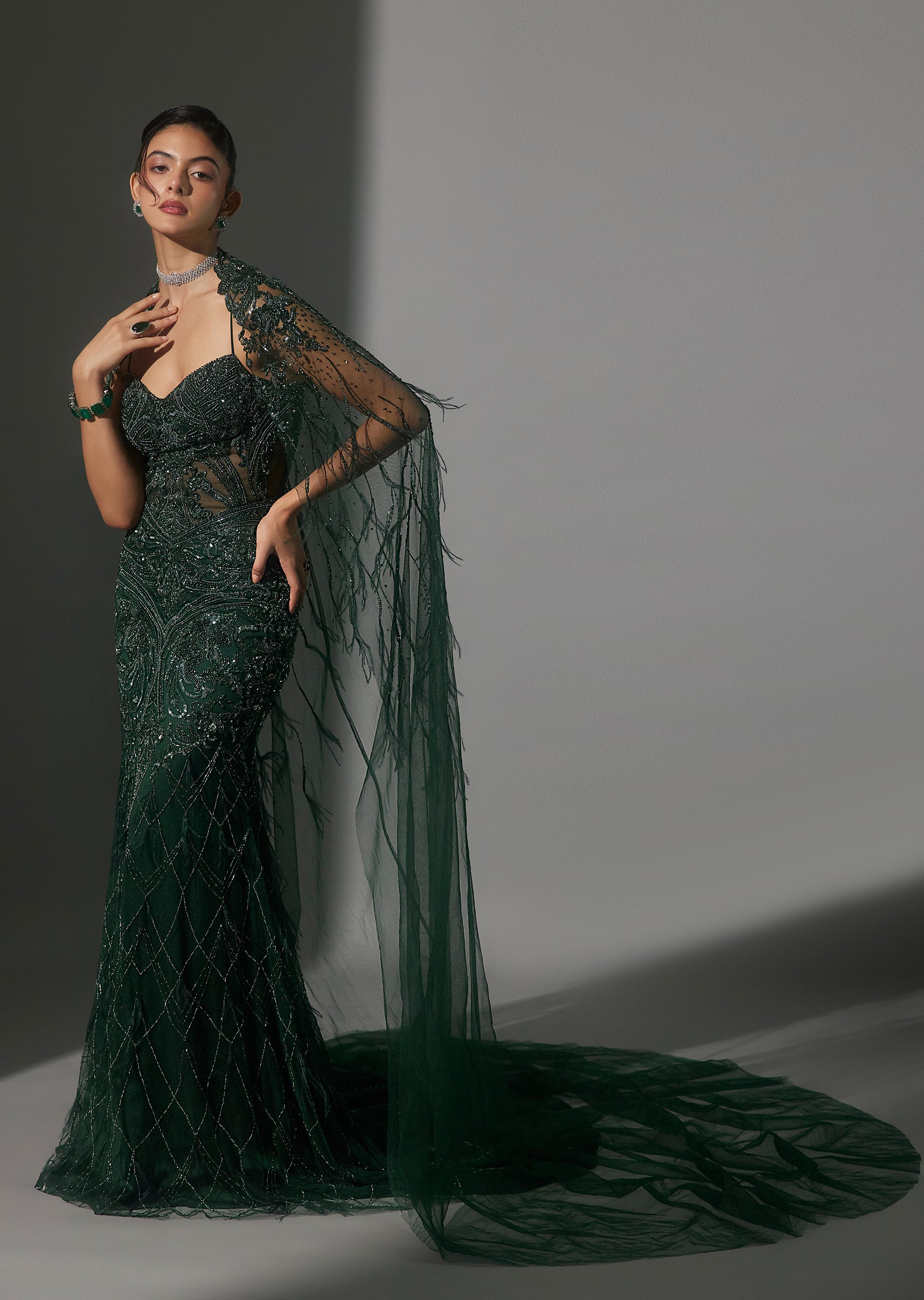 Green Hand Embroidered Bridal Gown Wih Feather Trimmed Net Cape