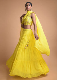 Lemon Yellow Lehenga In Tiered Pattern And Jaal Embroidered Sleeveless Choli Online - Kalki Fashion