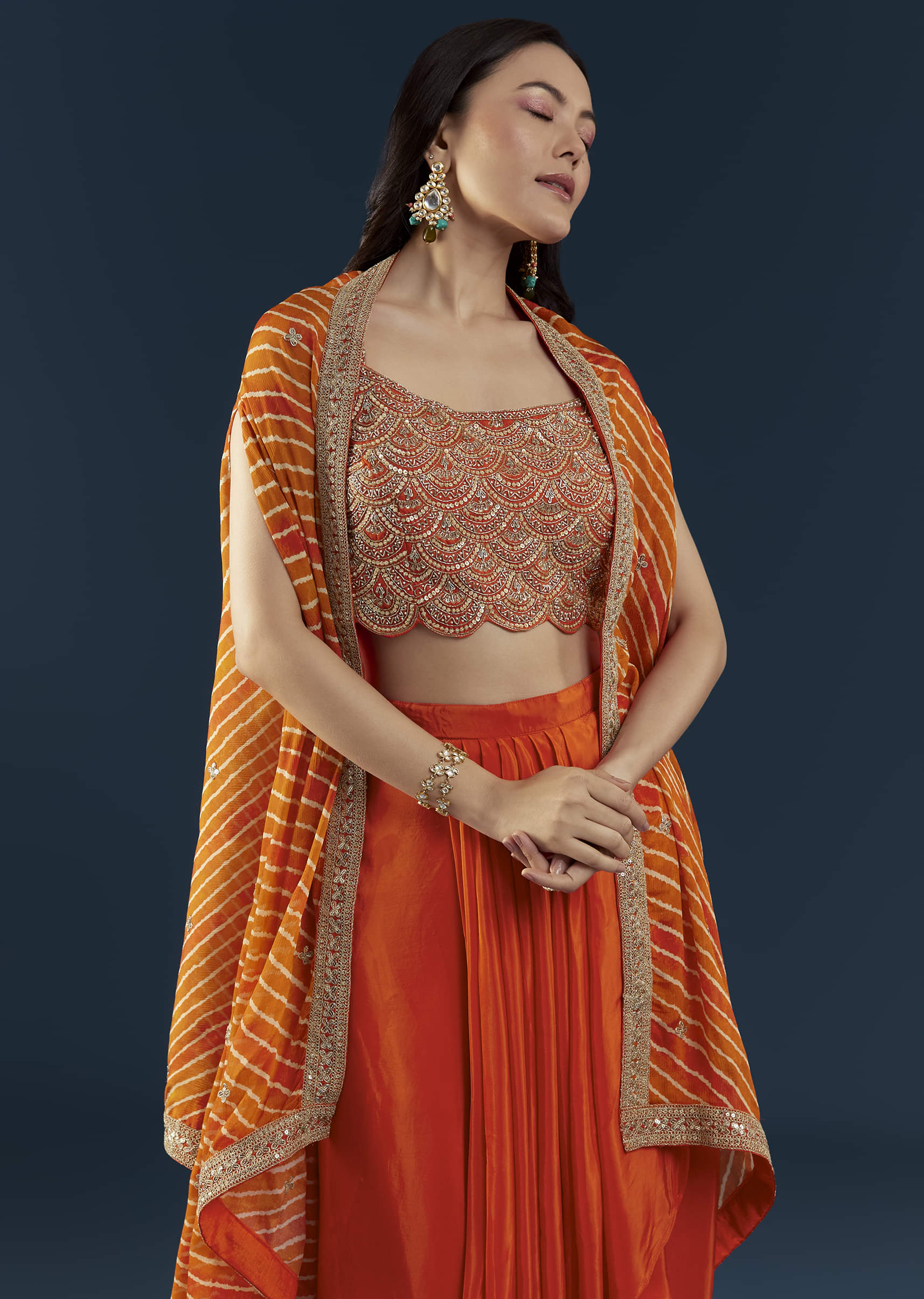 Orange Asymmetric Crop Top Skirt Set with Leheriya Cape