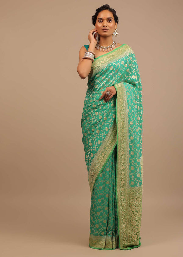 Peacock Green Traditional Saree Made With Georgette And A Beautiful Woven Floral Jaal