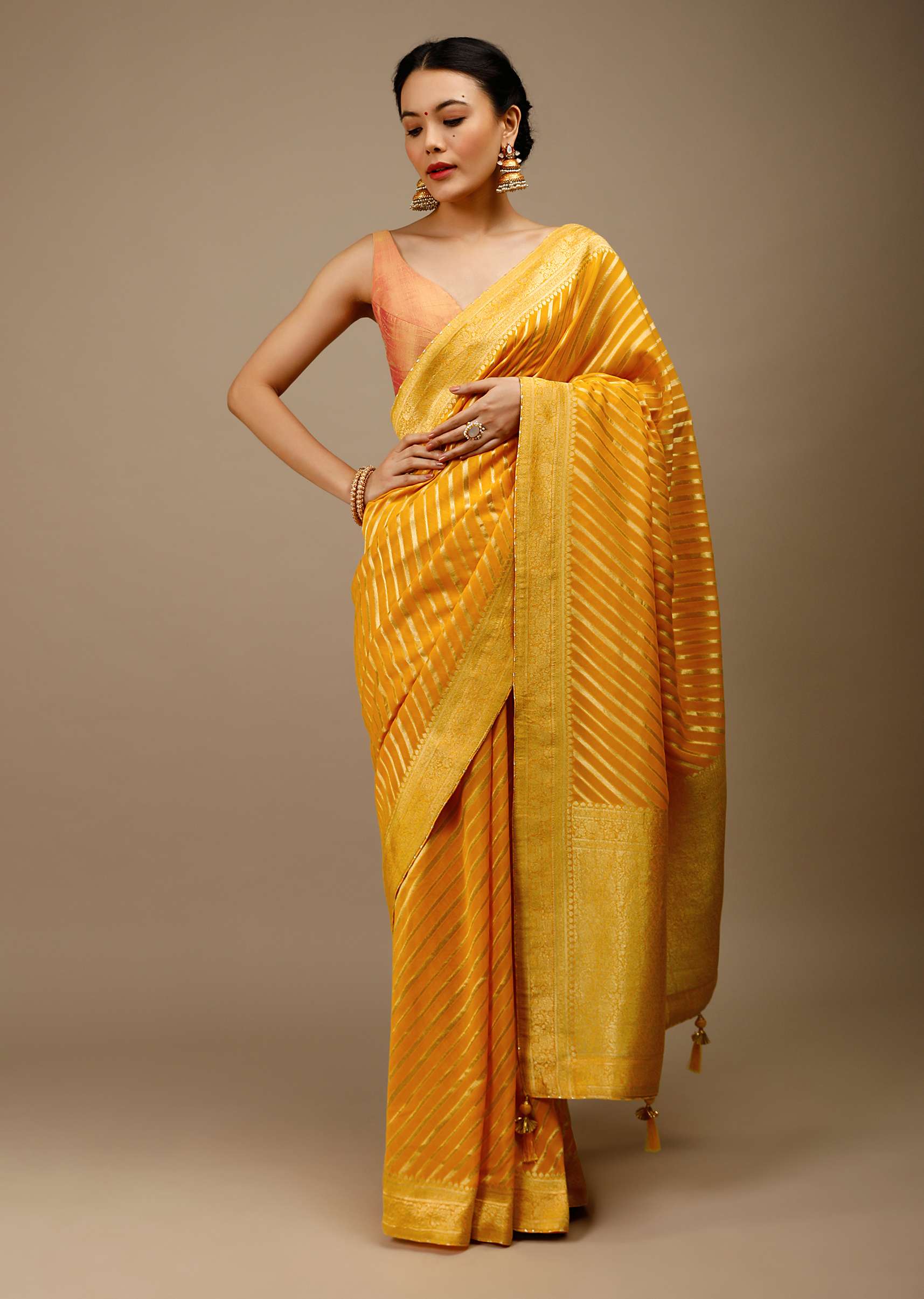 Radiant yellow georgette saree with brocade stripes