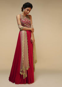 Rani Pink Anarkali Suit With Halter Neckline And Adorned In Multicolored Hand Embroidered Floral Design On The Bodice