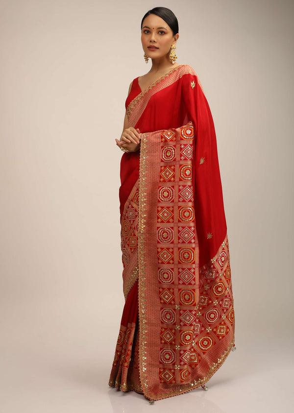 Red Saree In Silk With Brocade Geometric Design On The Border And Gotta Patti Work