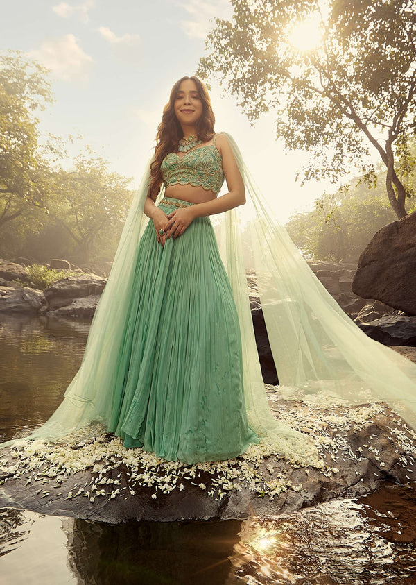 Sea Green Skirt And Crop Top Set Adorned With Green Toned Bead Work And Attached Drapes