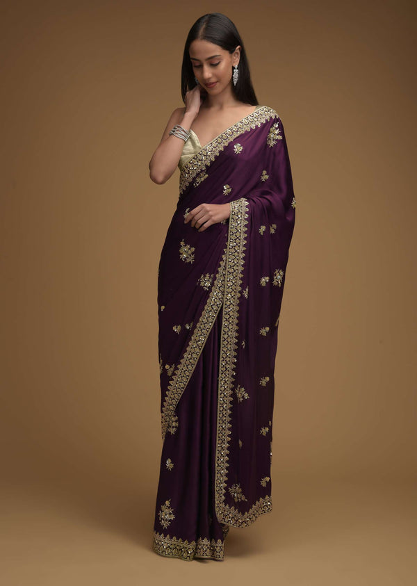 Wine Purple Saree In Satin With Hand Embroidered Floral Buttis Using Cut Dana And Sequins Work